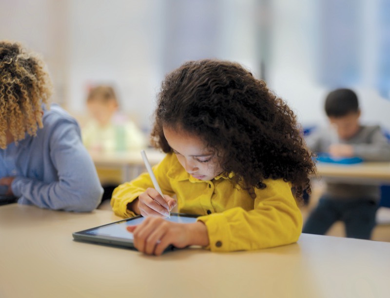 A student working through a Kumon maths worksheet